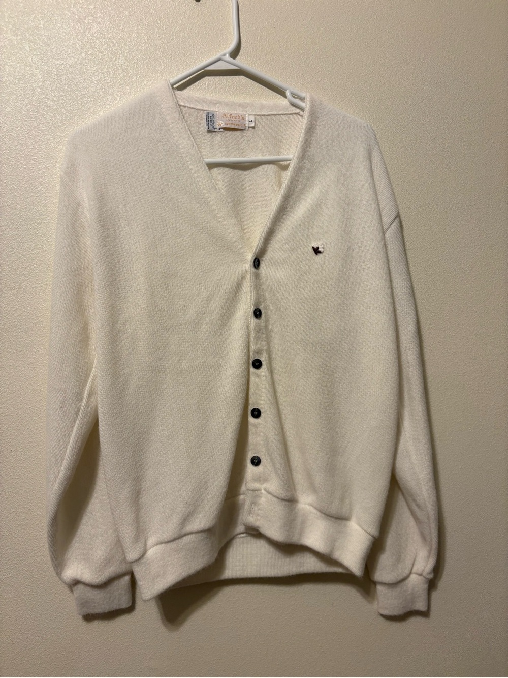 Classic Women’s White V-Neck Cardigan Sweater has small hole in sleeve